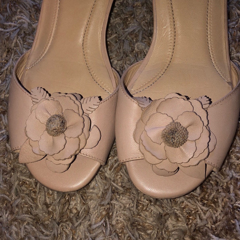 Nude Floral peep toe wedge.